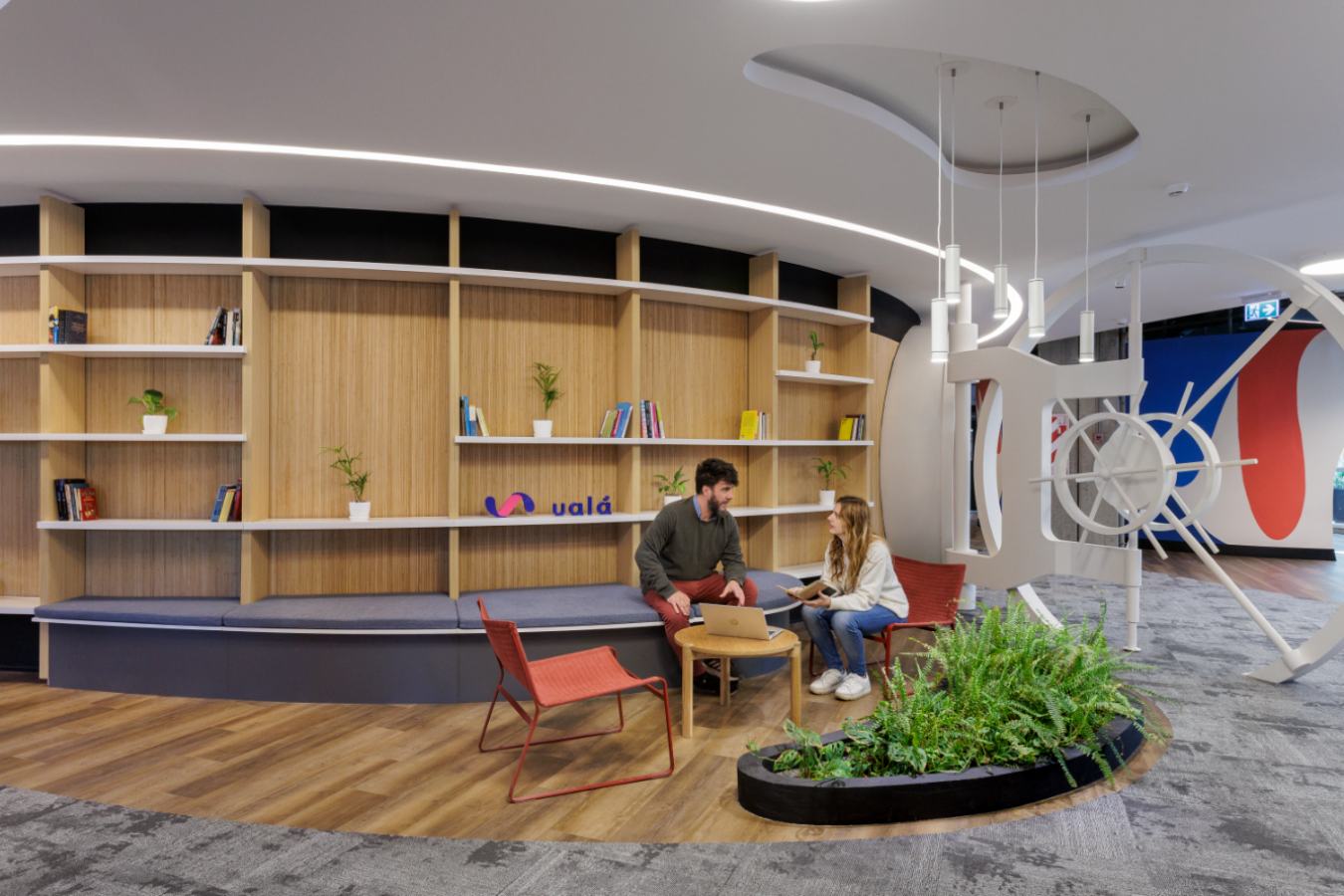 Uala Offices 2024 - Quiet library zone featuring mixed flooring and open-concept shelving - Contract Workplaces.jpg